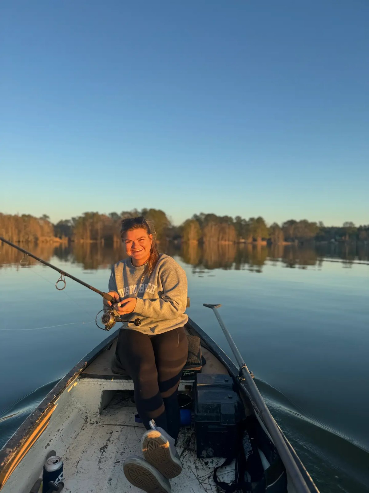 A Maritime Gal fishing from a jon boat at first light